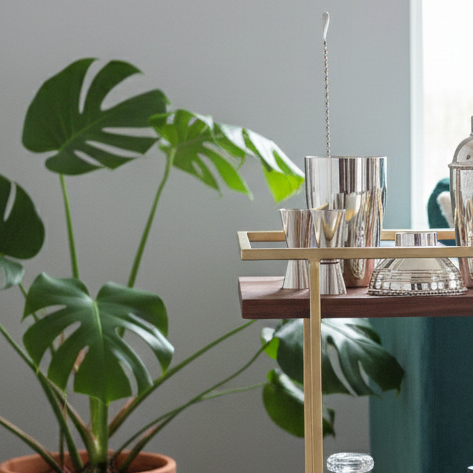 Bar cart with drinks and glasses in a living room setting