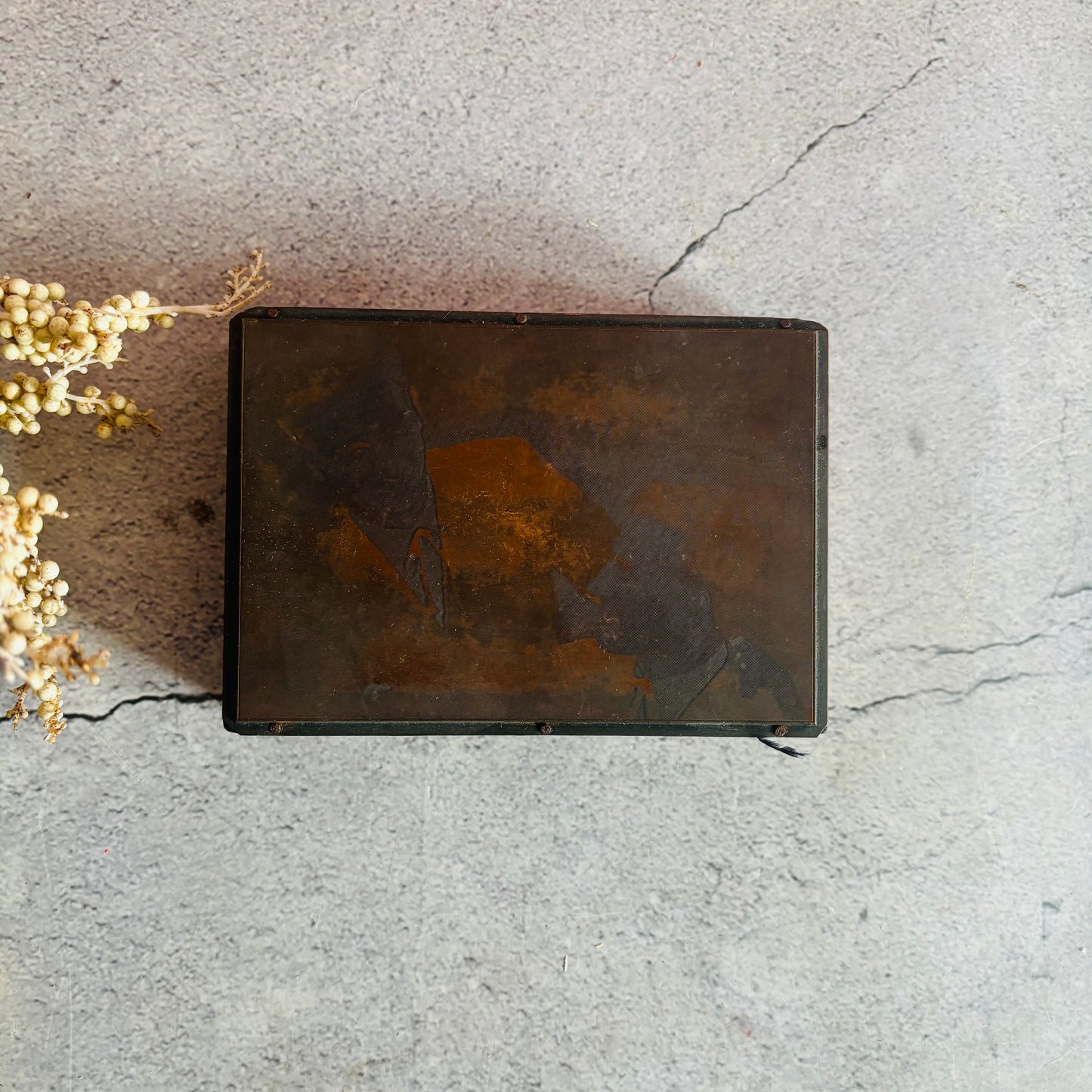 Vintage Copper Printing Plate portrait of men on a textured surface