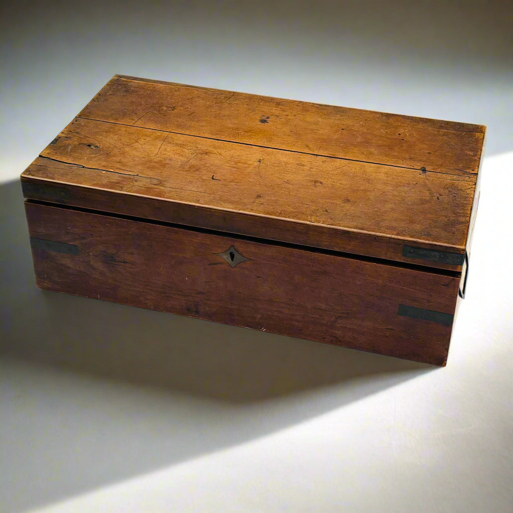 Wooden box with a worn surface on a light background
