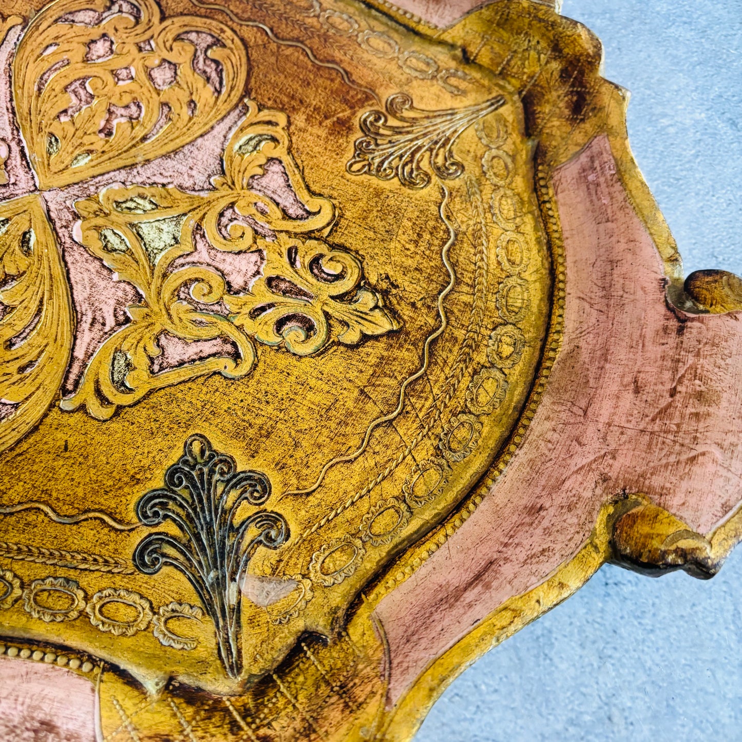Decorative fragment with intricate gold patterns on a blue background