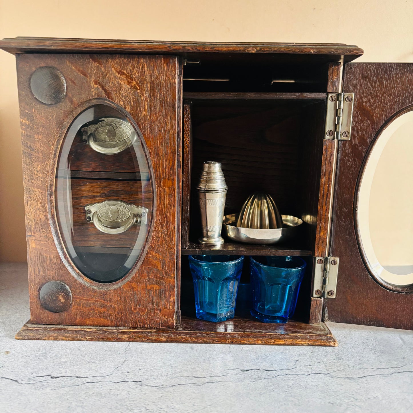 Antique Arts & Crafts Oak Cabinet with glass doors containing bar accessories