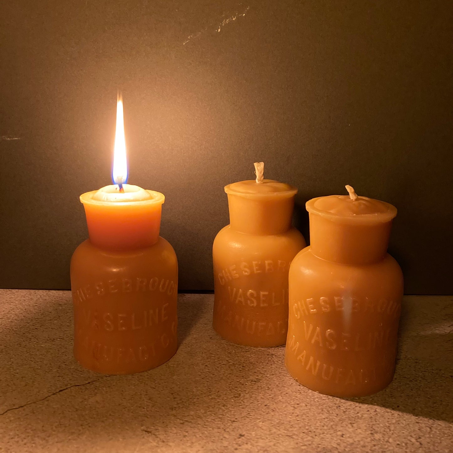 Handmade Beeswax Candles in Antique Bottle Designs