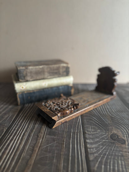 Antique Italian Miniature Book Slide Folding and Expanding Book Holder on a textured surface with a neutral background