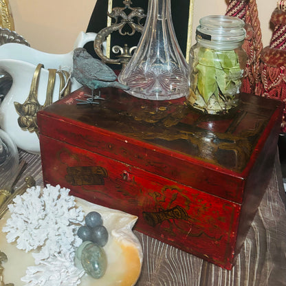 Vintage wooden box with decorative items on a table
