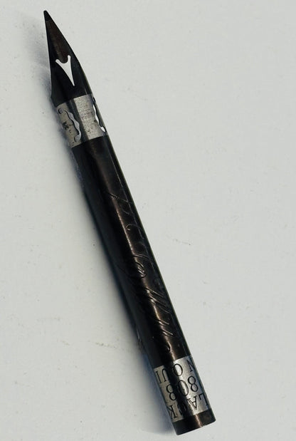 A black dip pen with silver metal accents and engraved details, shown diagonally on a plain light gray background.
