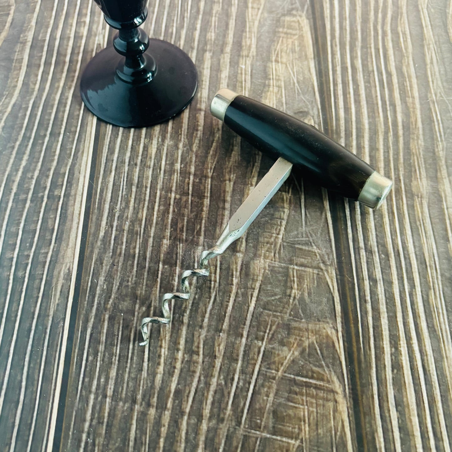 Corkscrew on a wooden surface