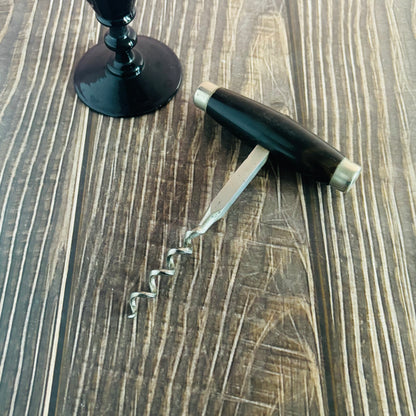 Corkscrew on a wooden surface