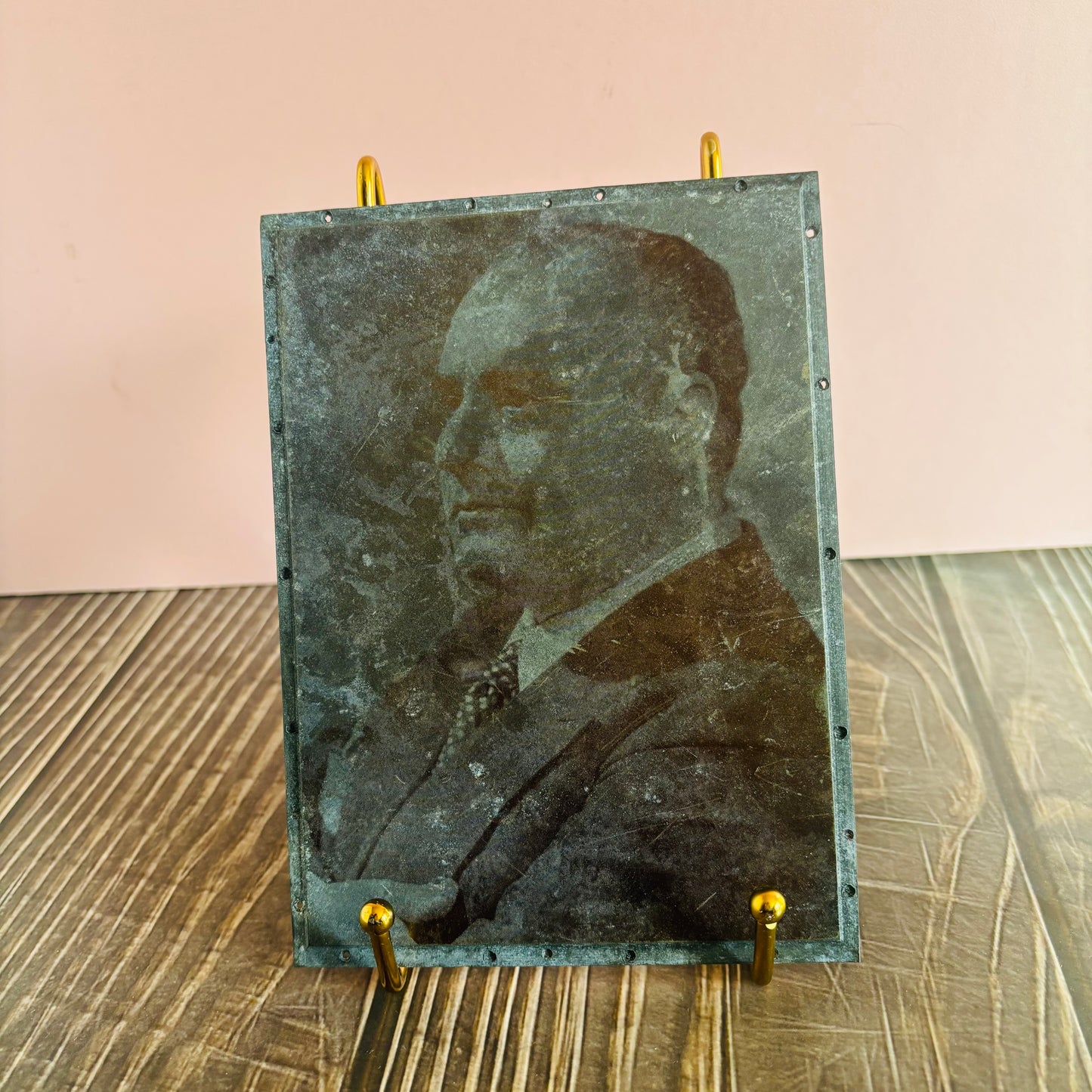 Vintage-style portrait on a stand with a plain background