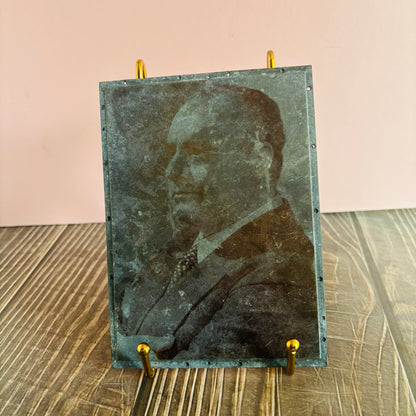 Vintage-style portrait on a stand with a plain background