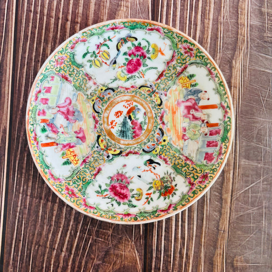 Decorative ceramic plate with intricate patterns on a wooden surface