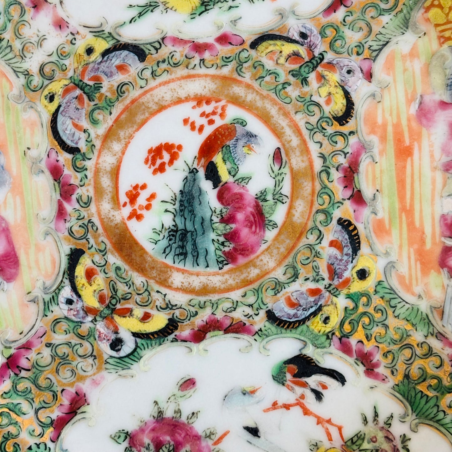 Decorative ceramic plate with colorful floral and bird patterns