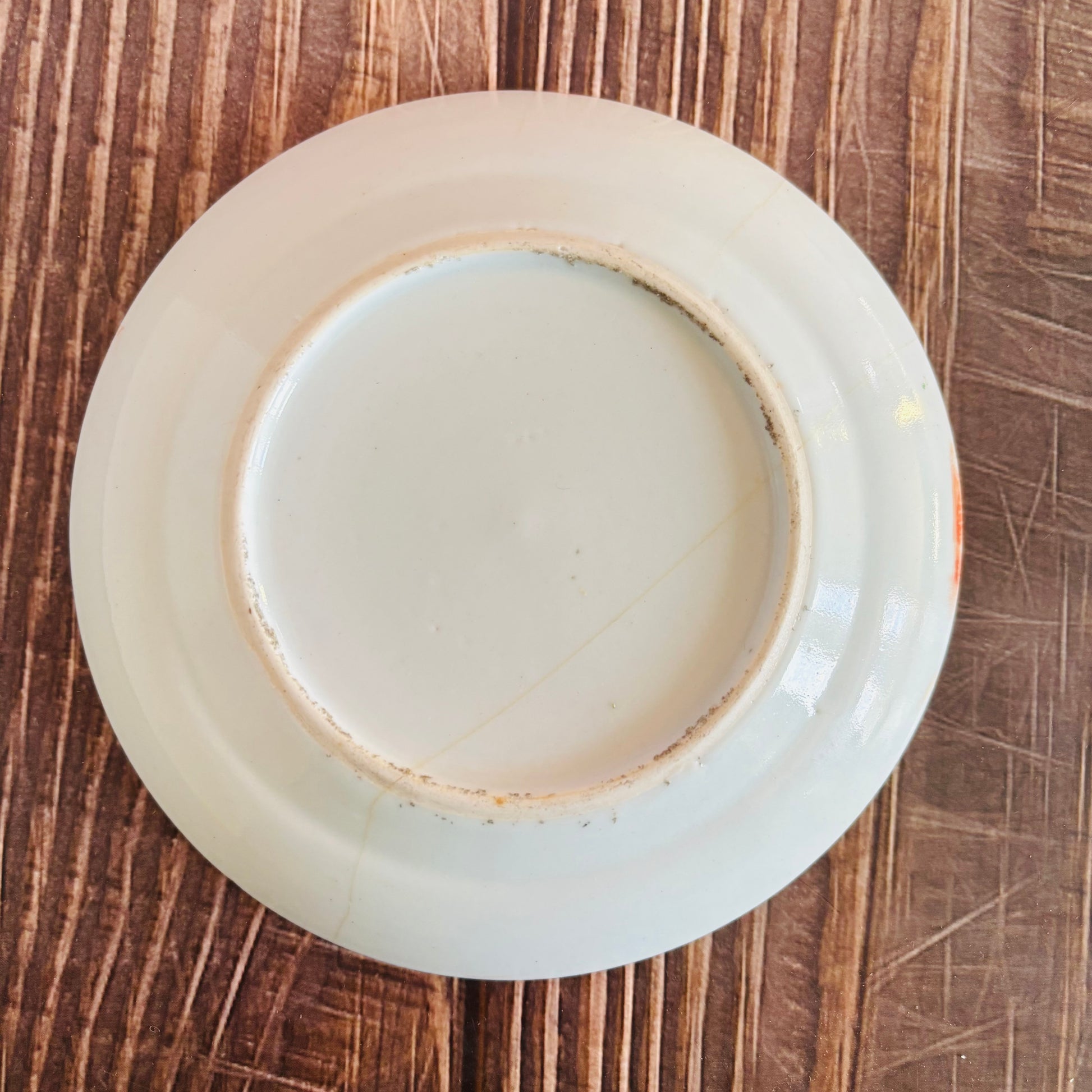 White ceramic plate on a wooden surface