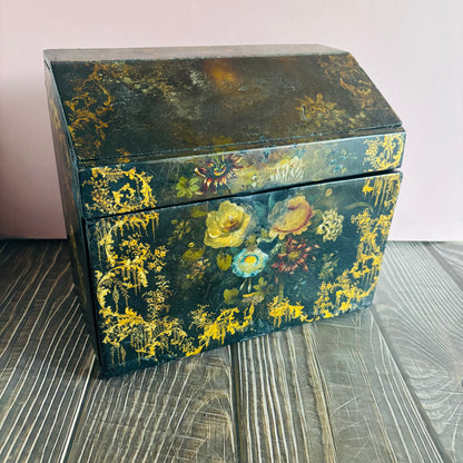 Victorian Paper Mache Lacquer Stationery Box  with hand painted floral patterns on a wooden surface