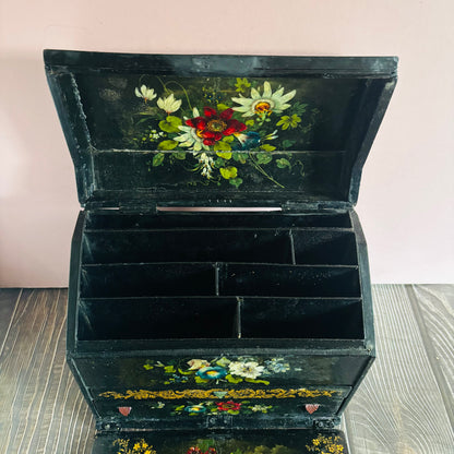 Victorian Paper Mache Lacquer Stationery Box  with hand painted floral patterns on a wooden surface