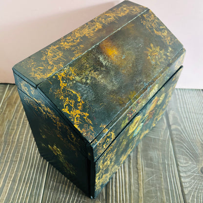 Victorian Paper Mache Lacquer Stationery Box  with hand painted floral patterns on a wooden surface