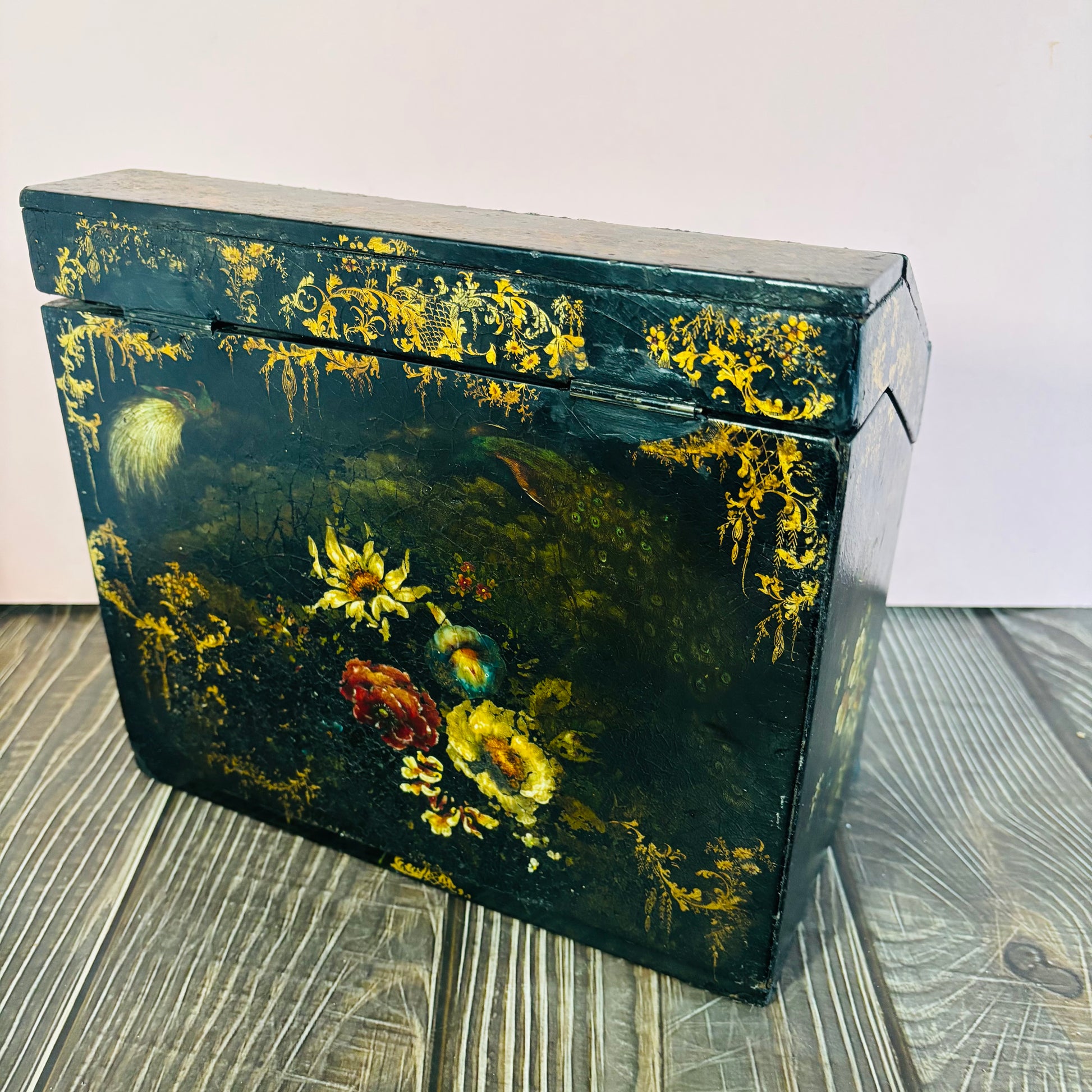 Victorian Paper Mache Lacquer Stationery Box  with hand painted floral patterns on a wooden surface