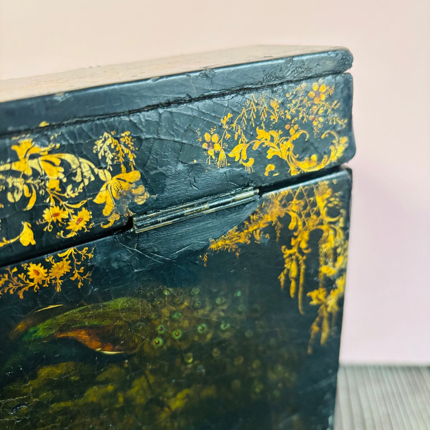 Victorian Paper Mache Lacquer Stationery Box  with hand painted floral patterns on a wooden surface
