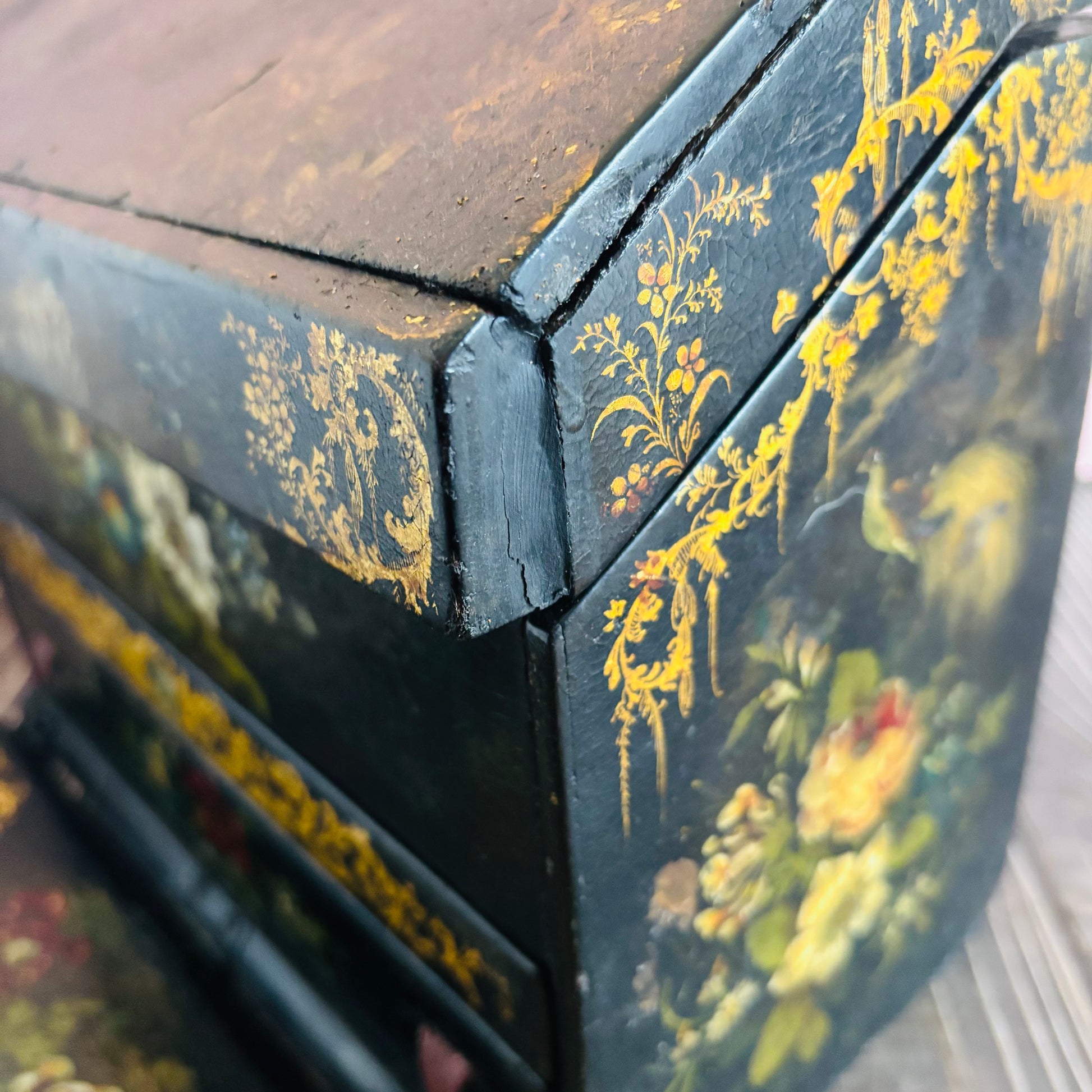 Victorian Paper Mache Lacquer Stationery Box  with hand painted floral patterns on a wooden surface