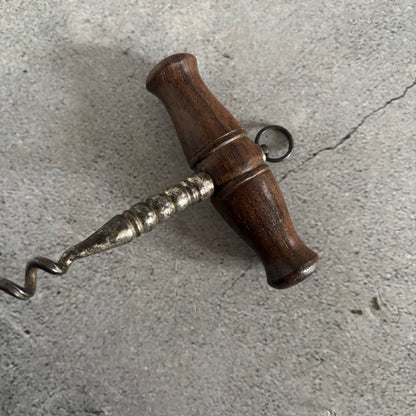Wooden corkscrew on a concrete surface