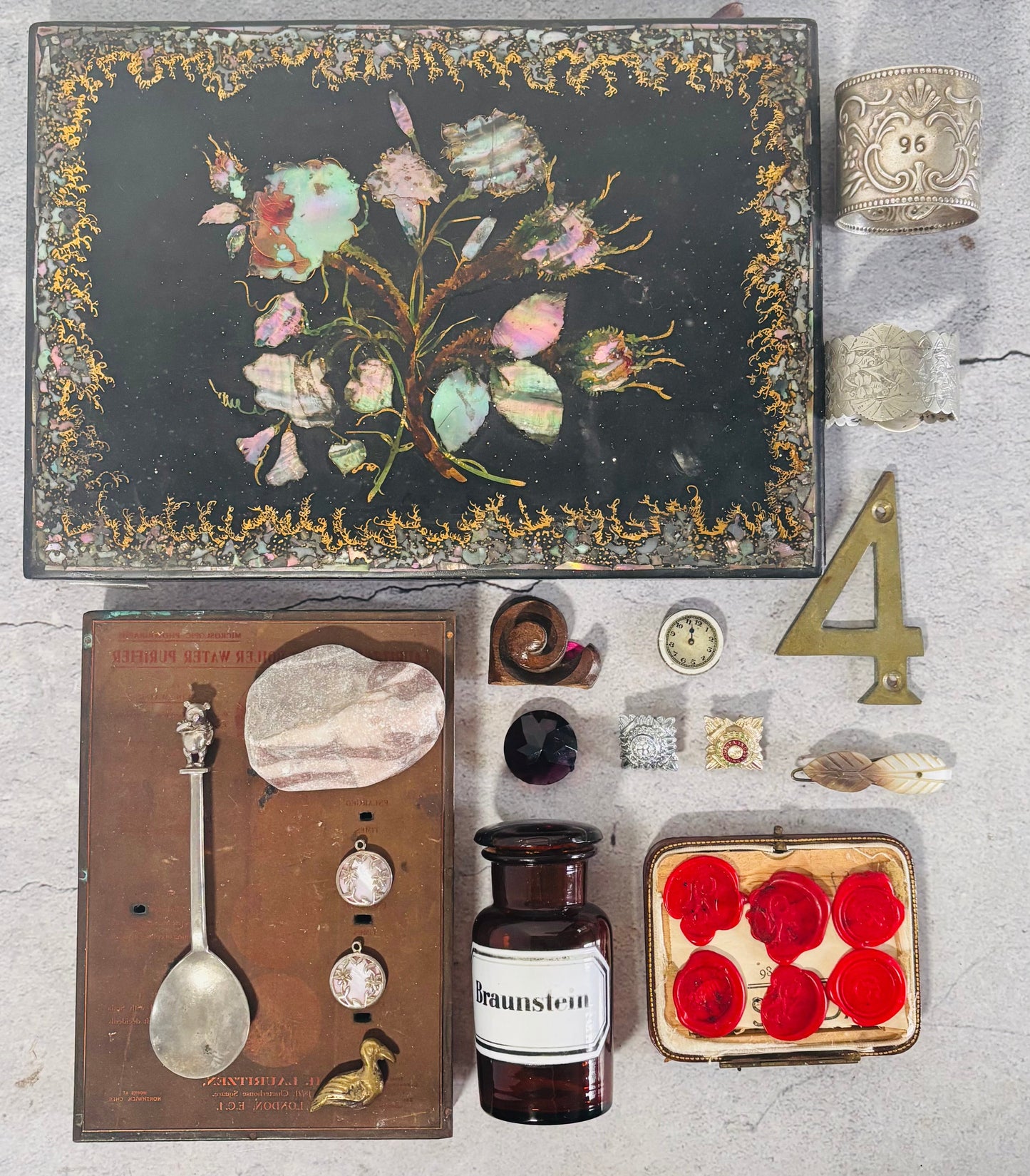 Antique Flatlay Creative Bundle | The Urban Vintage Affair Collection of vintage items including a decorative box, bottle, and small containers on a textured surface.