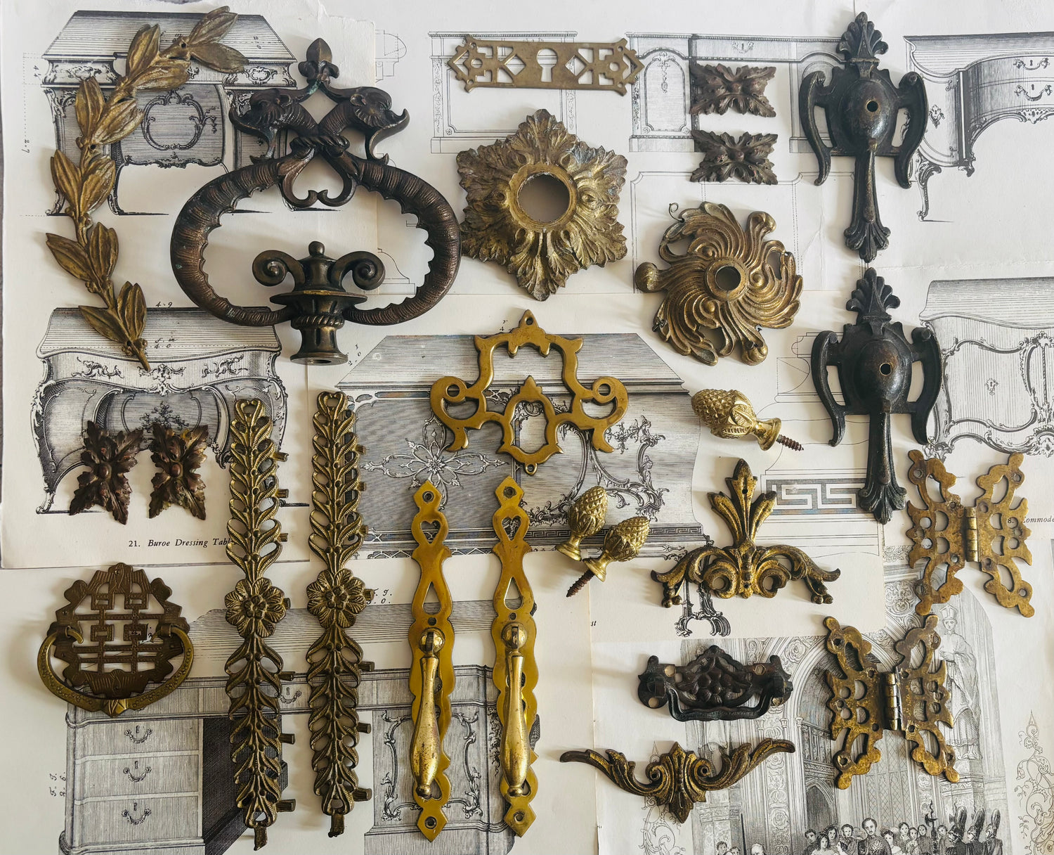 Collection of decorative metal hardware on a textured background