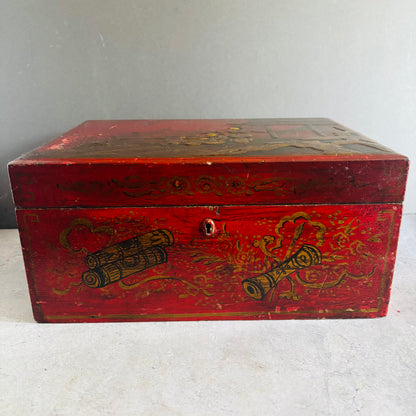 Red wooden box with gold decorative elements on a light gray background