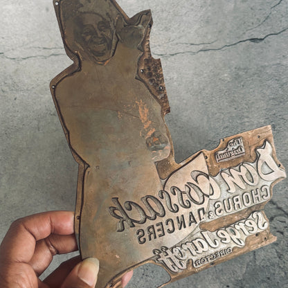 antique copper printing plate on a grey background