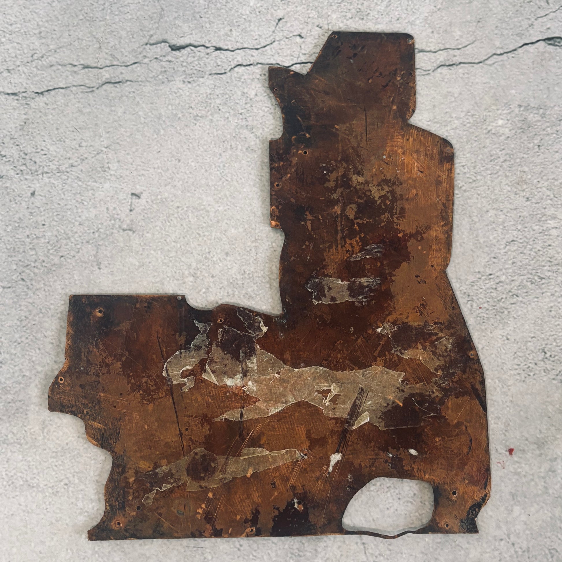 antique copper printing plate on a grey background