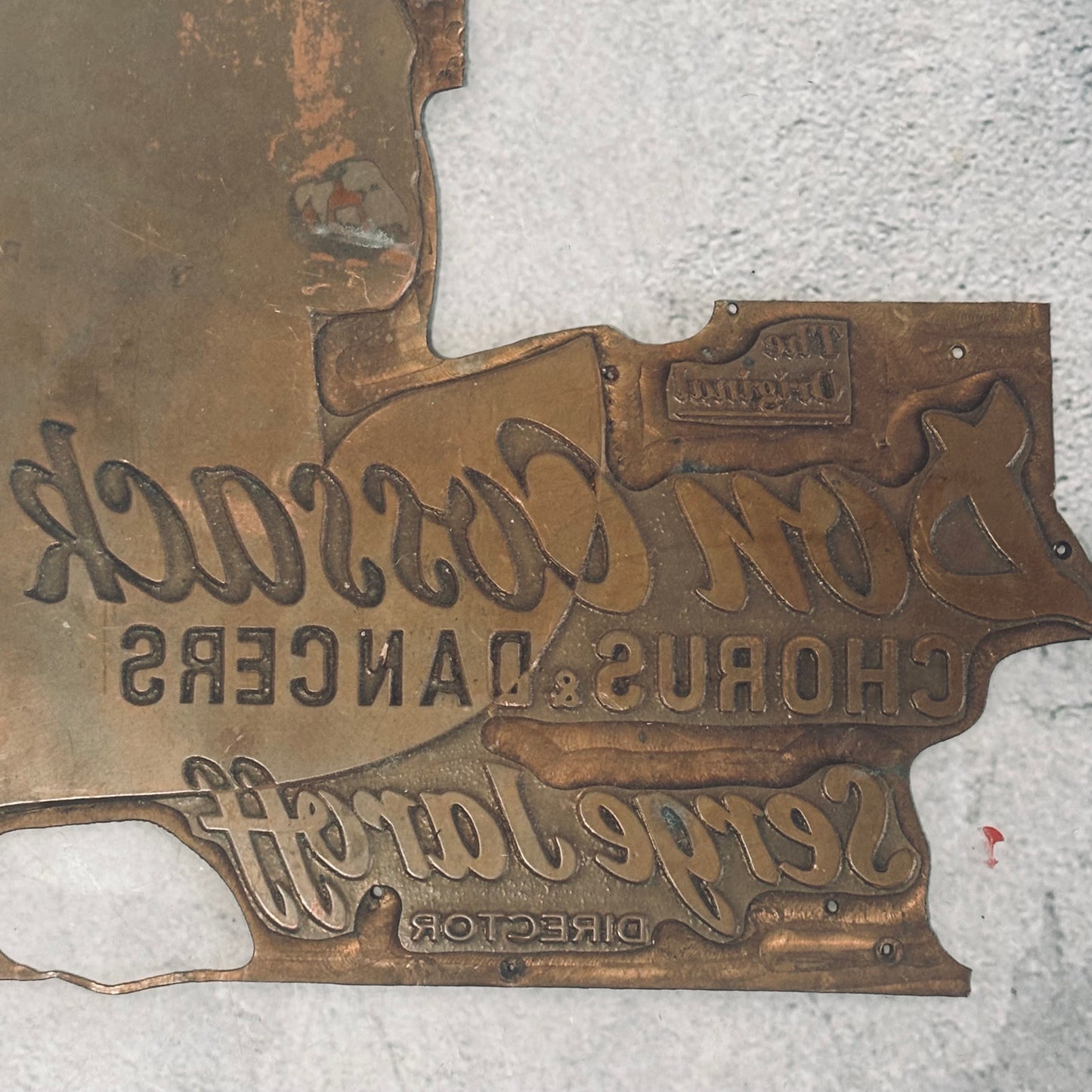 antique copper printing plate on a grey background