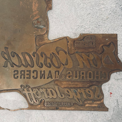 antique copper printing plate on a grey background
