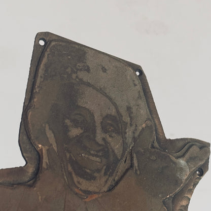 antique copper printing plate on a grey background
