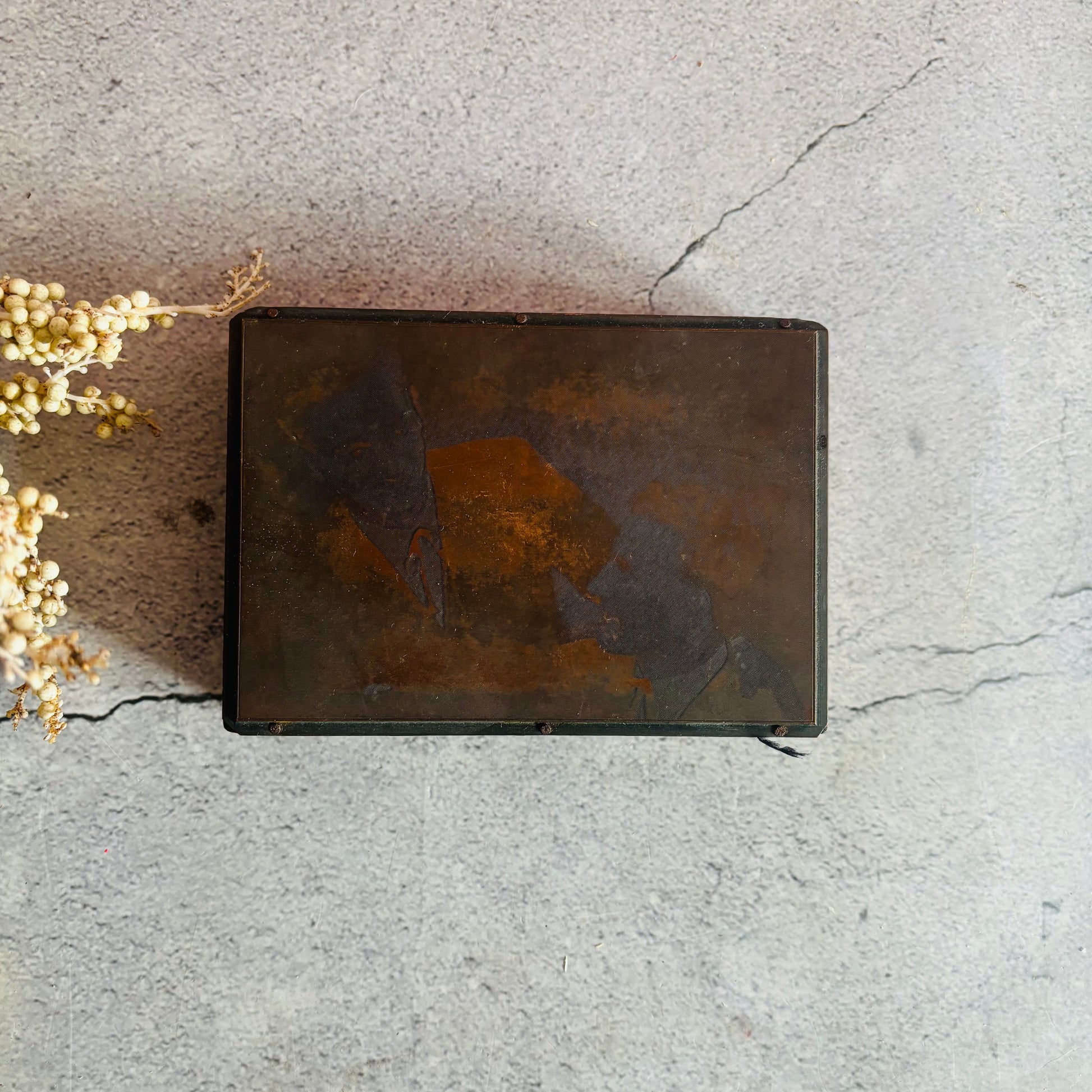 Vintage Copper Printing Plate portrait of men on a textured surface 