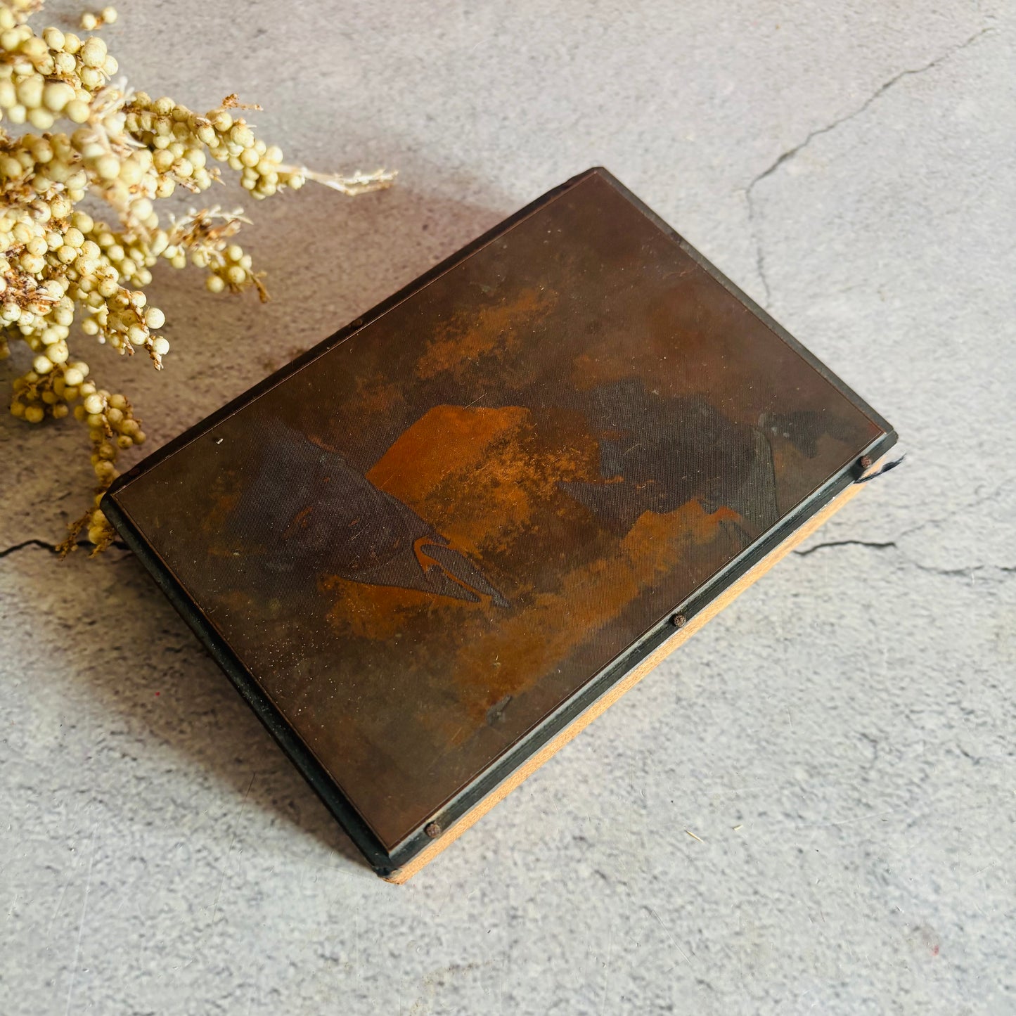 Vintage Copper Printing Plate portrait of men on a textured surface