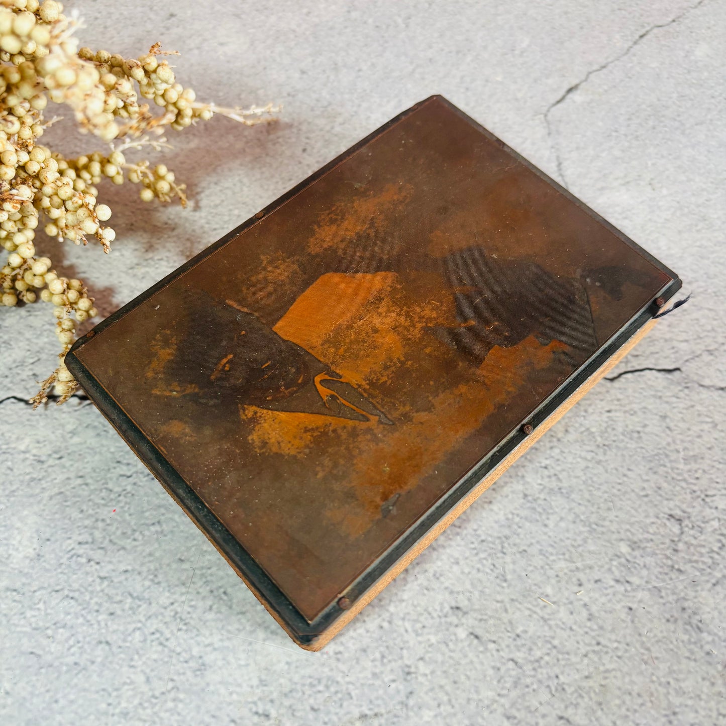 Vintage Copper Printing Plate portrait of men on a textured surface