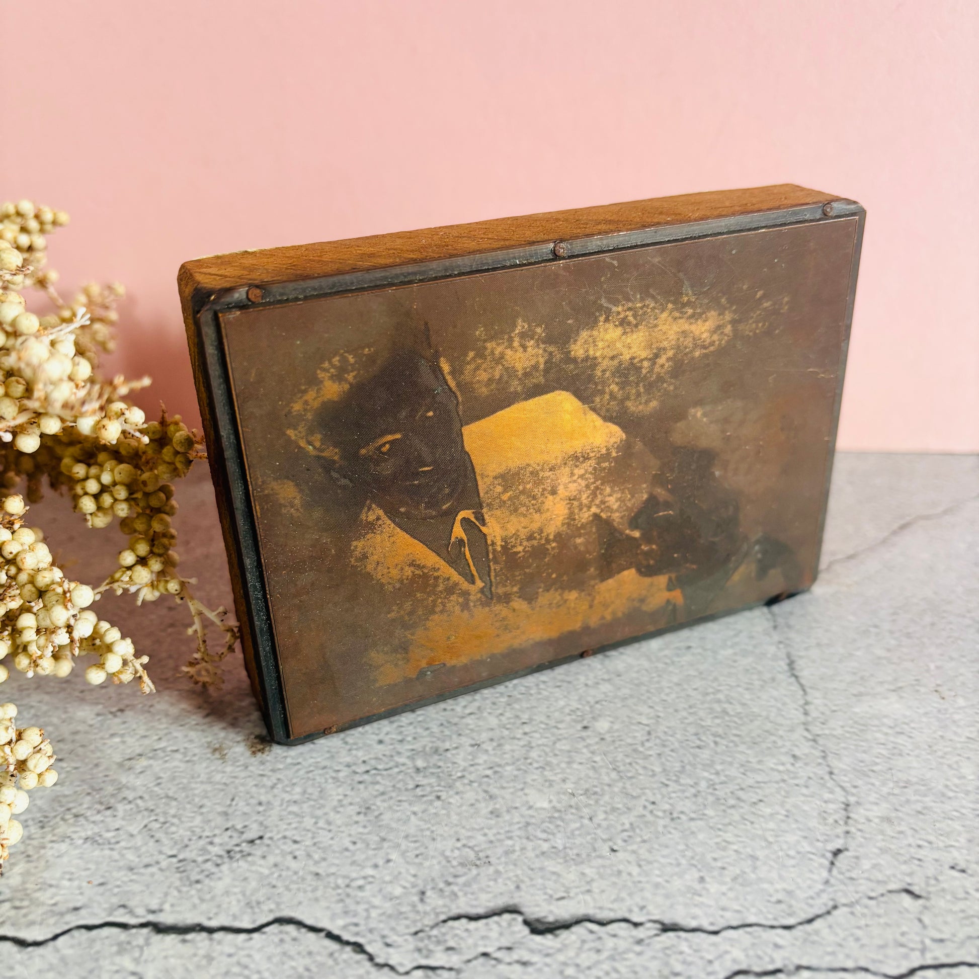 Vintage Copper Printing Plate portrait of men on a textured surface with a pink background