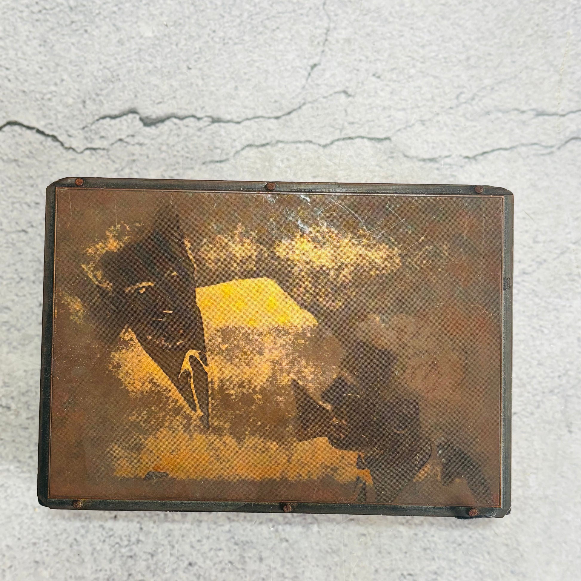 Vintage Copper Printing Plate portrait of men on a textured surface
