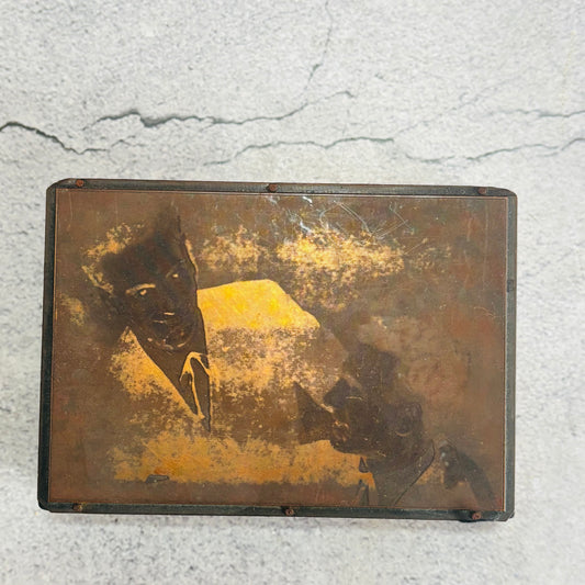 Vintage Copper Printing Plate portrait of men on a textured surface