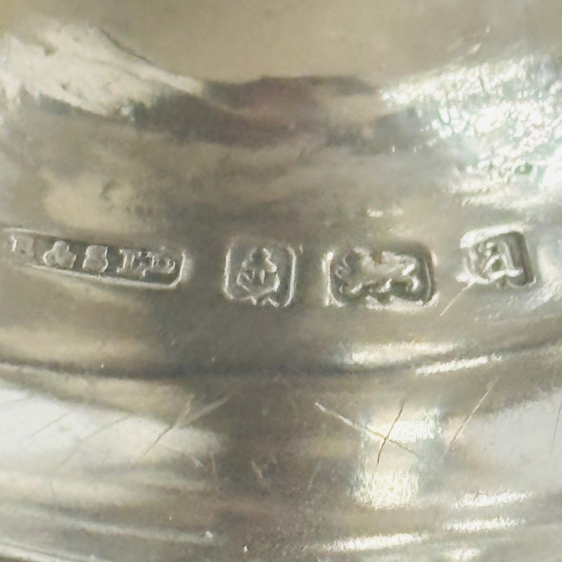 Close-up of a silver antique hallmarks