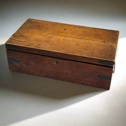Wooden box with a worn surface on a light background