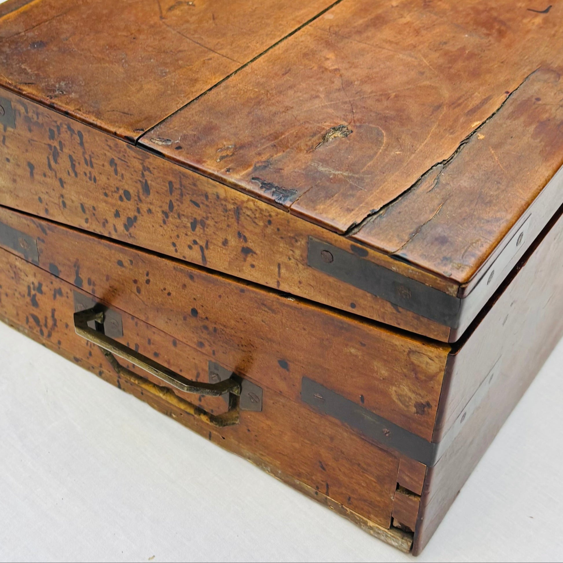 Wooden box with a lid on a white surface