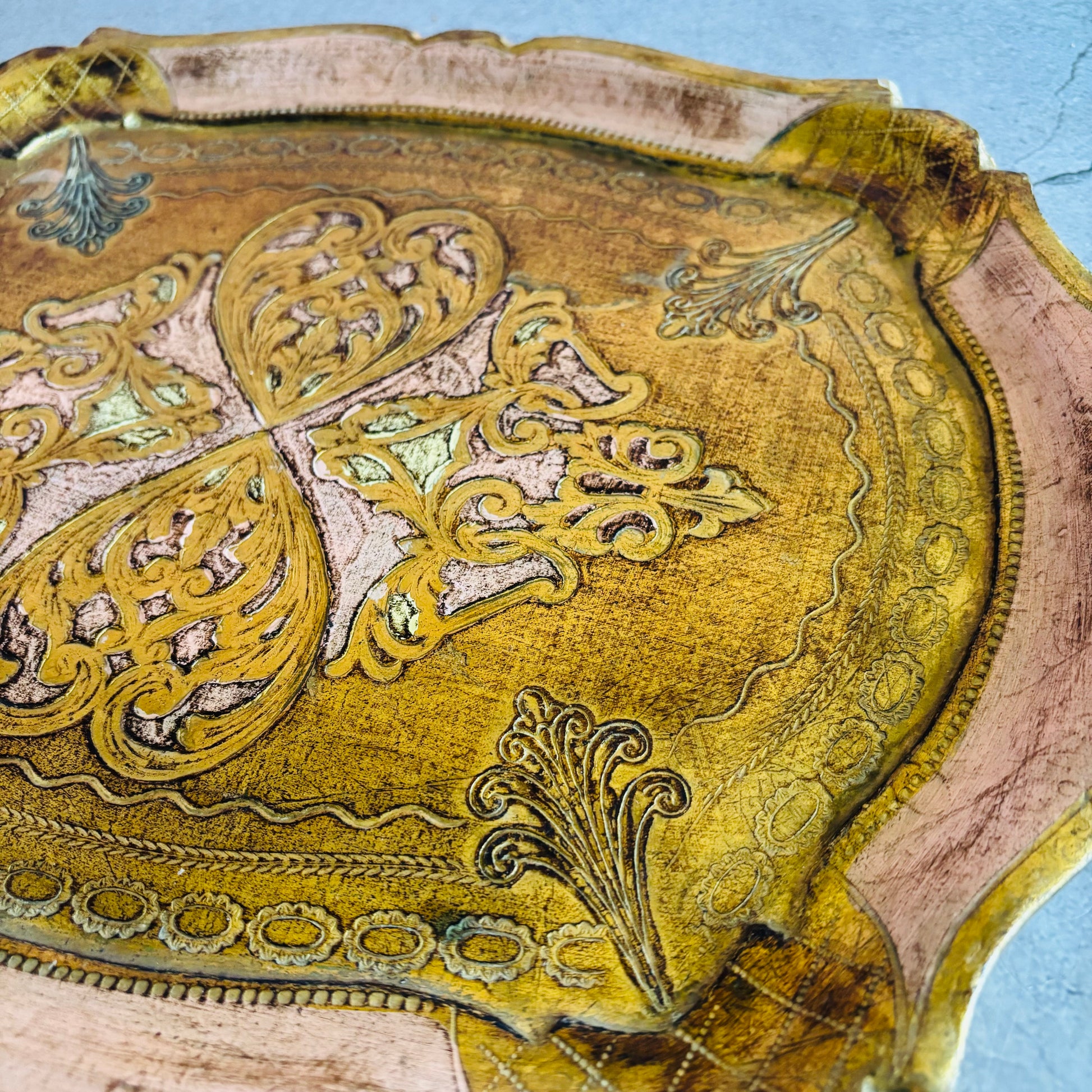 Decorative wooden tray with intricate carvings 