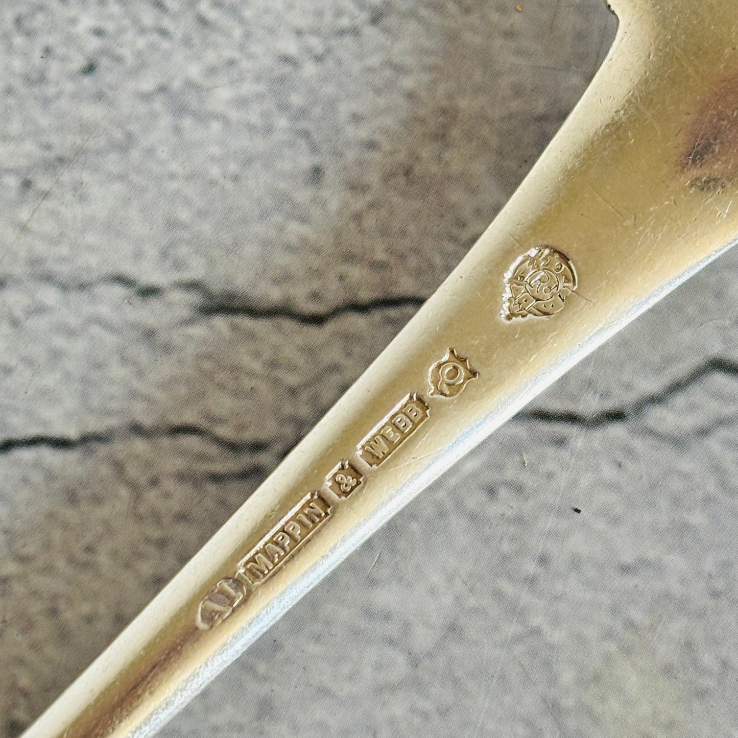 Close-up of antique cutlery engraved silver plate marks for Mappin and Webb