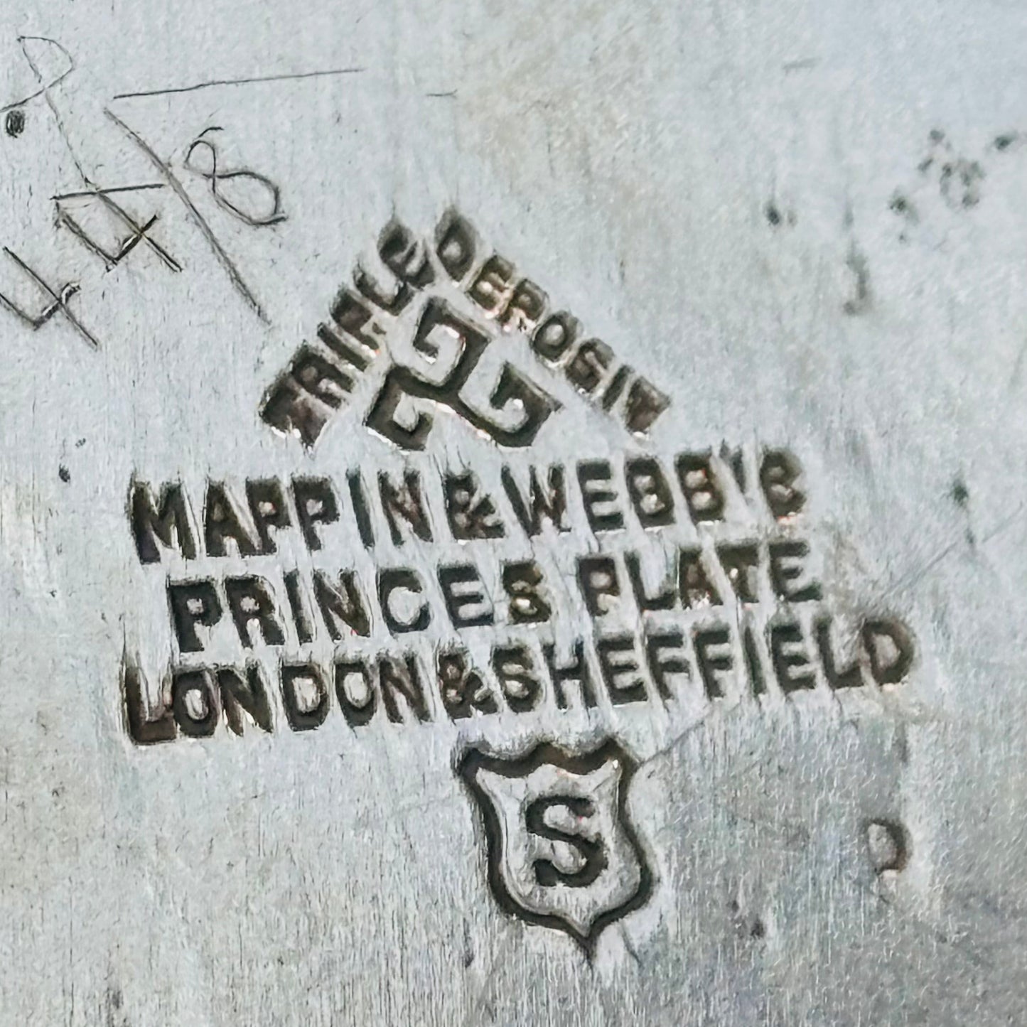 Mappin & Webb's Princes Plate stamp on a metallic surface