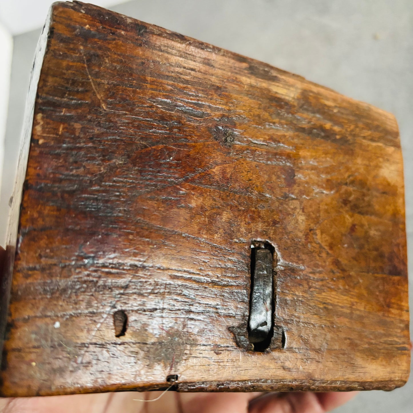Vintage wooden box with a metal latch on a white background