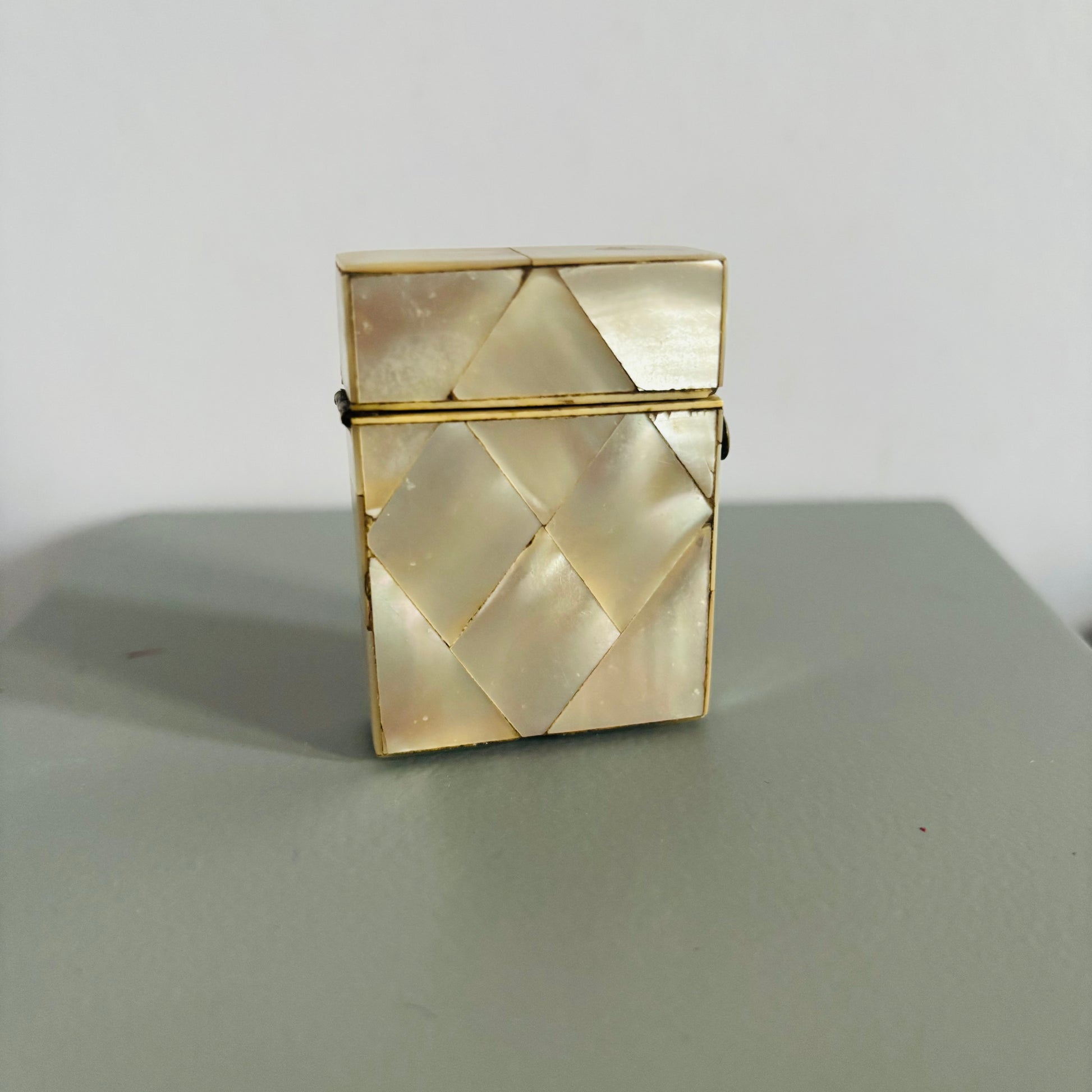 Decorative Rare Antique Mother Of Pearl Vesta  on a grey surface with a white background