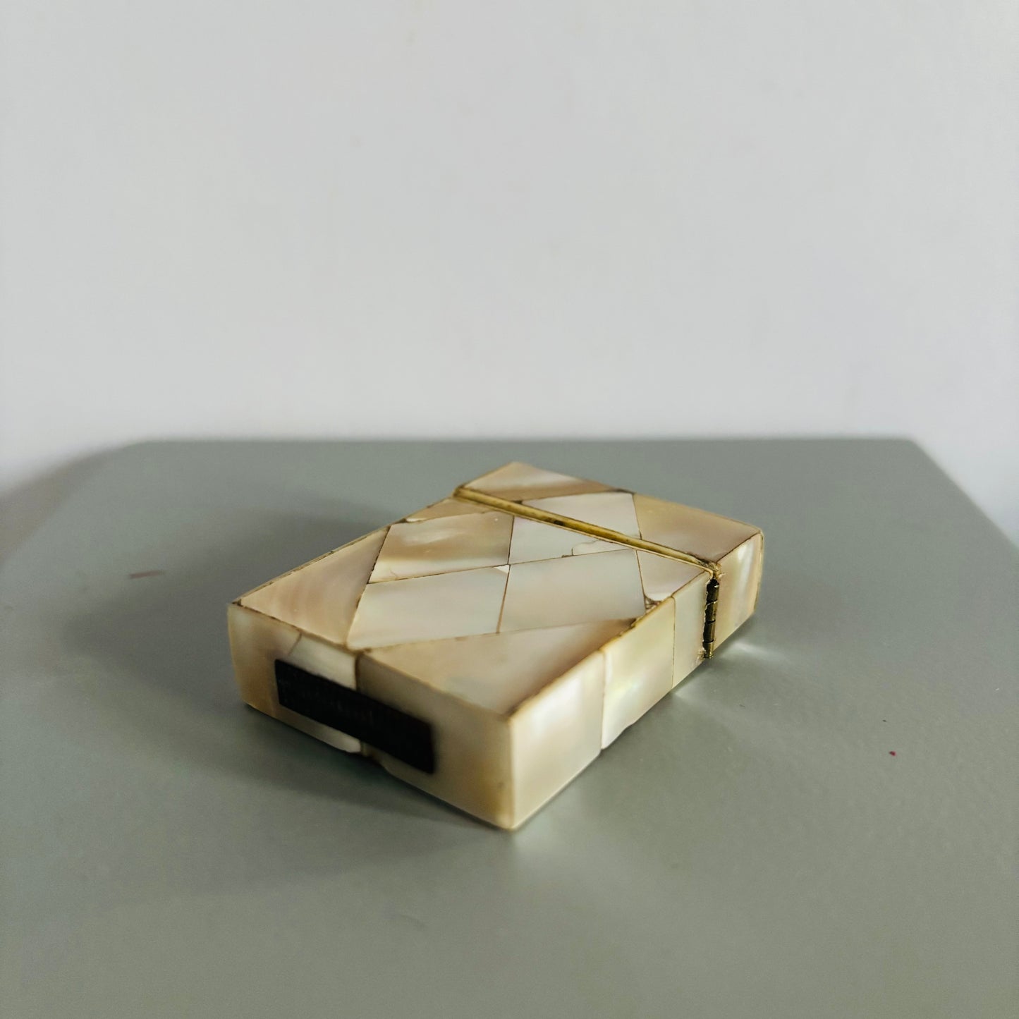 Decorative vesta with geometric design on a gray surface