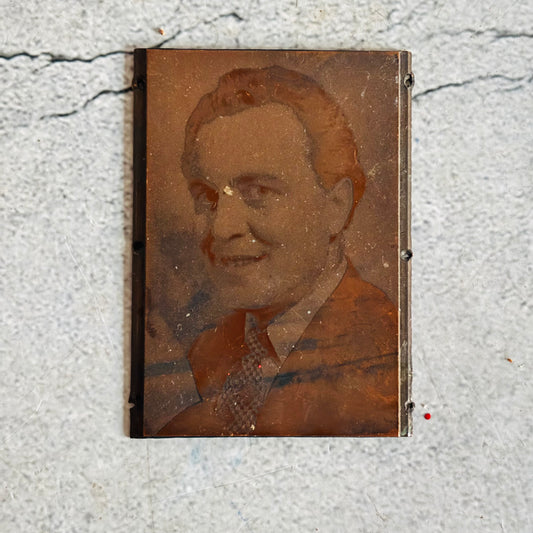 Vintage Copper Printing Plate Portrait of Man on a textured surface