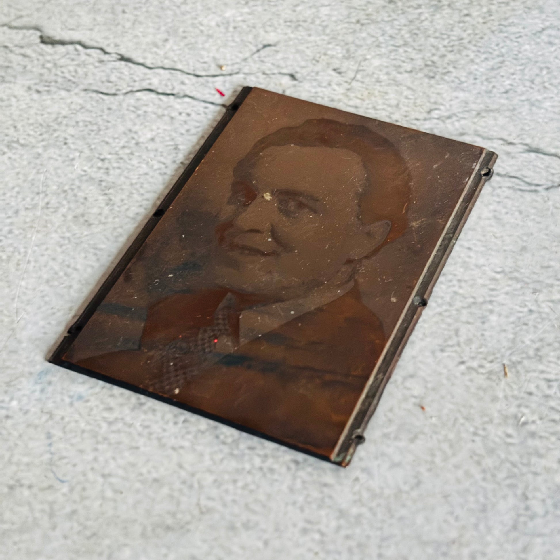 Vintage Copper Printing Plate Portrait of Man in a suit on a textured surface