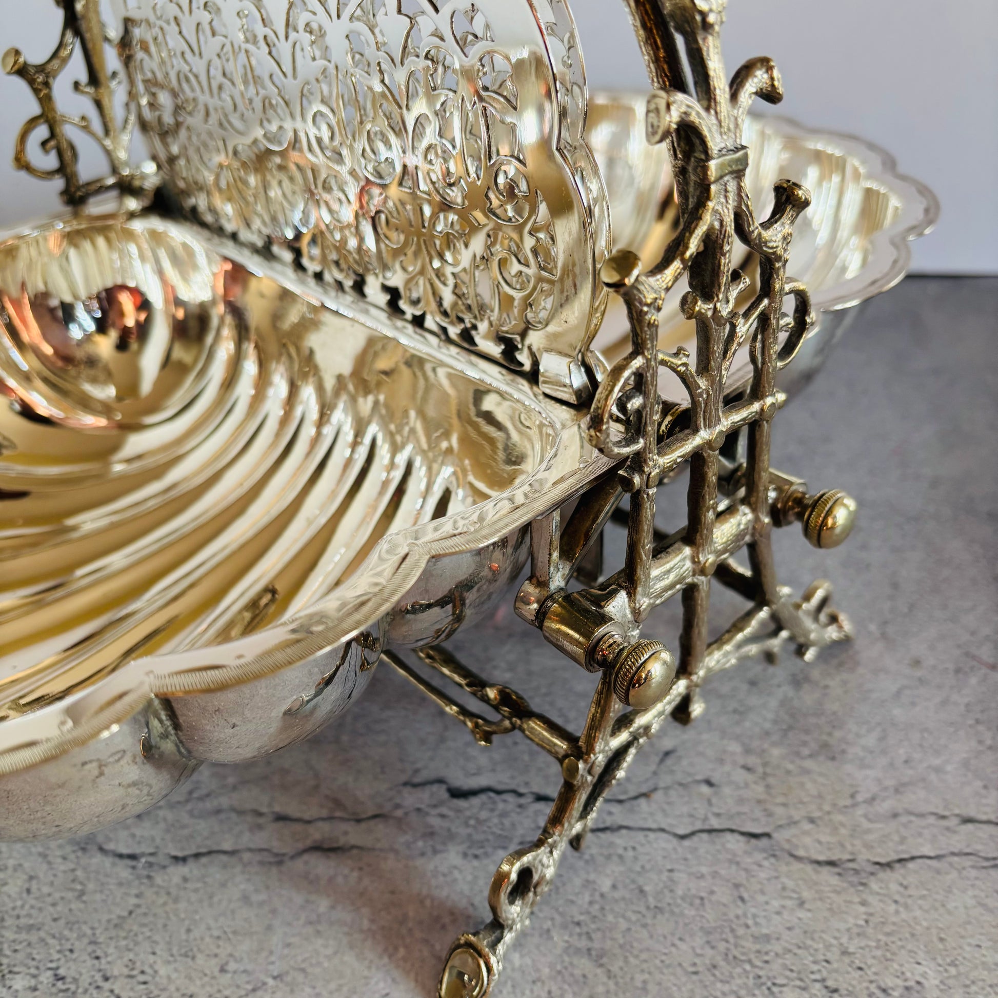 Decorative metal bowl with intricate designs on a textured surface