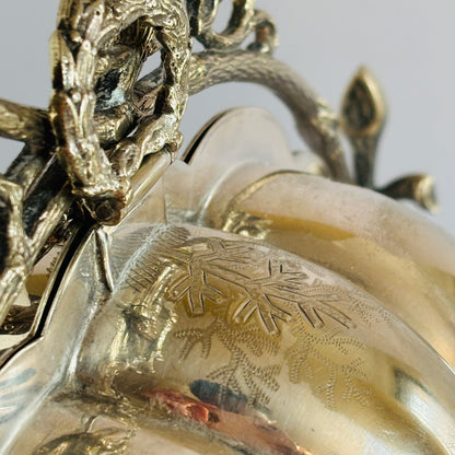 Close-up of a decorative object with intricate designs on a plain background